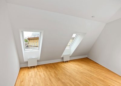 loft with windows and radiators