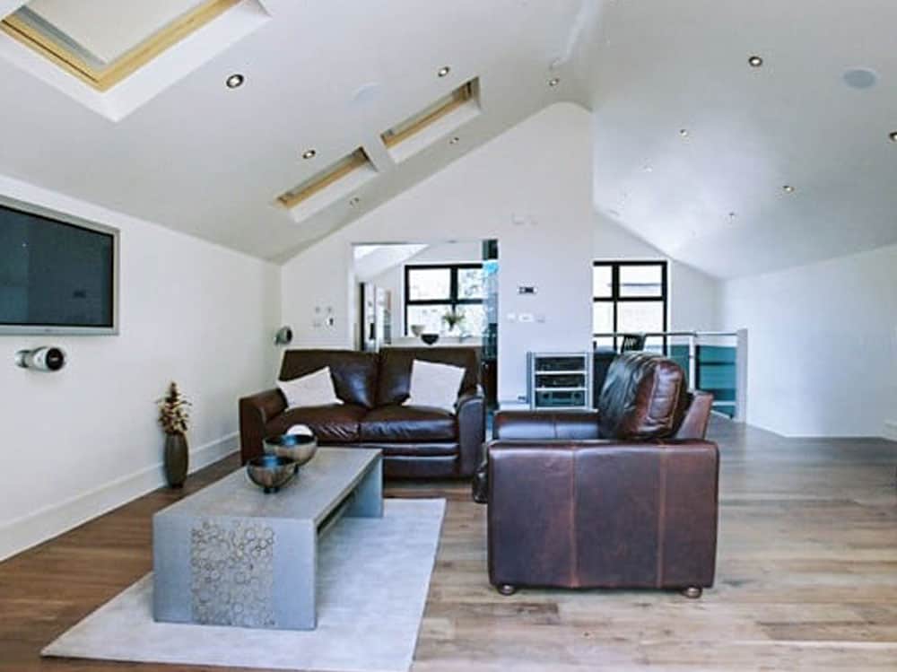 Molesey loft conversion with leather chairs<br />
